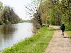 Man riding bike of the Erie Canal Trail