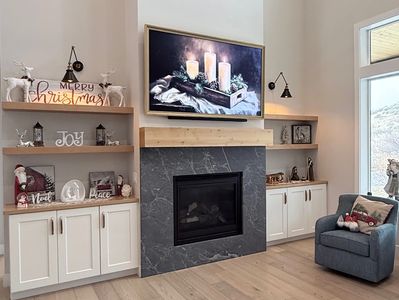 75 inch Samsung Frame TV mounted above fireplace in Vineyard Utah using motorized MantelMount