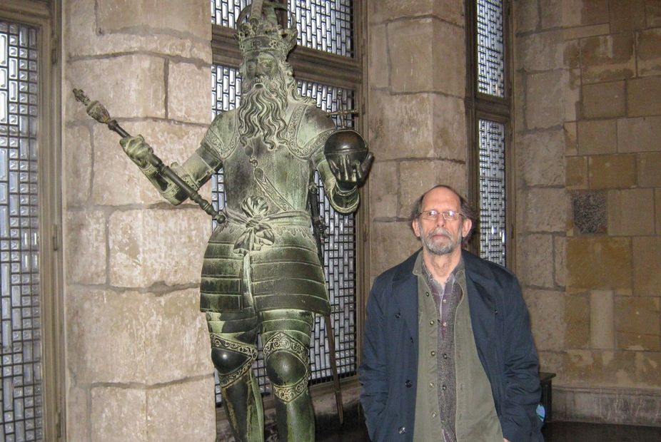 Jeffrey Wynter Koon standing by the statue of Charlemagne, Aachen City Hall, Germany. Photo by Nancy
