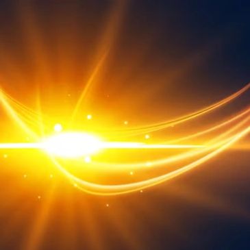 Bright golden light rays spreading in a dark background.