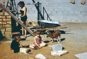 Virginia Lovness laying stone in her Usonian house, 1956