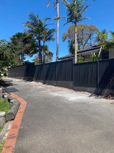 colorbond good neighbour wavelok gun metal grey 1800 high metal fence, light weight concrete sleepers