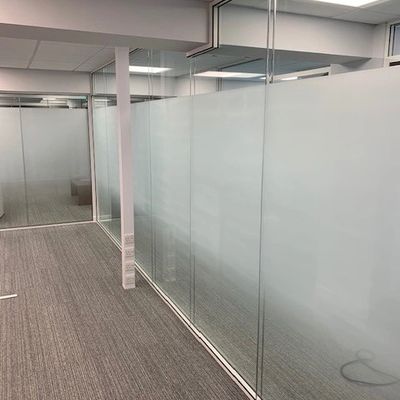 Glass partition installation in modern Kent commercial office by TJW Designs Rochester
