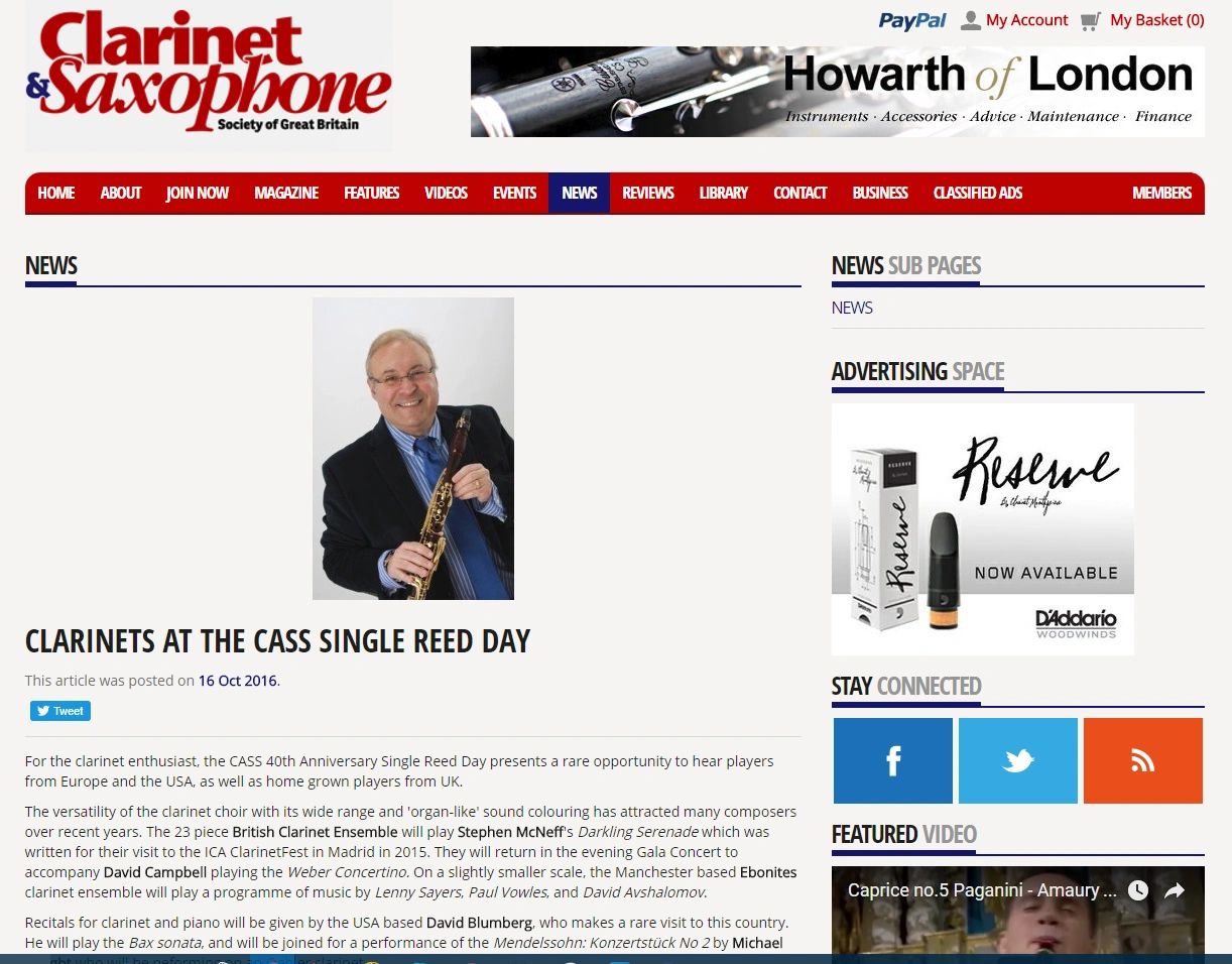 Man holding a clarinet and smiling, featured on Clarinet & Saxophone Society news page.