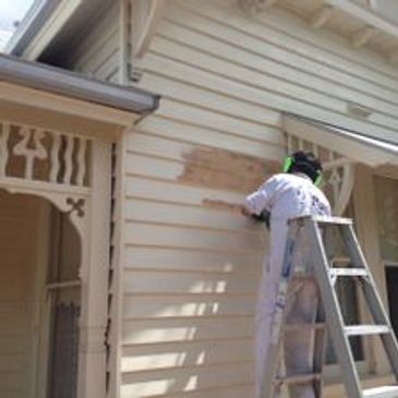 Prepping the weatherboards ready for painting