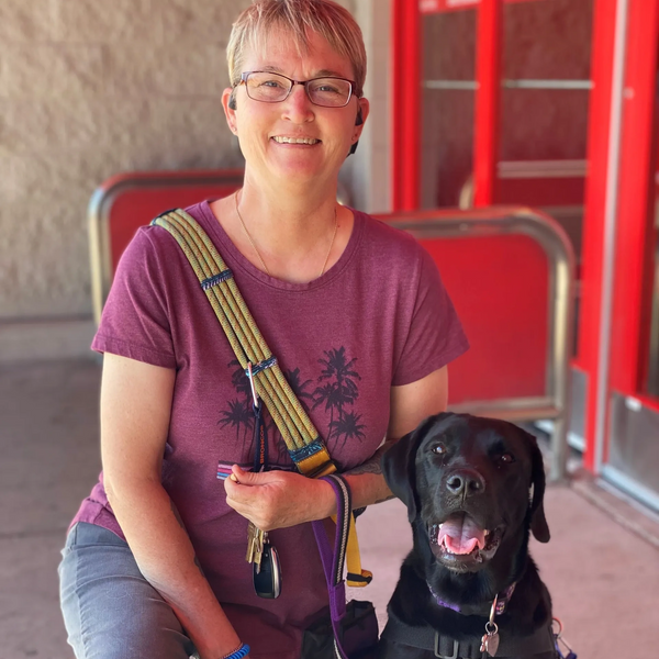 A serive dog handler team outside the store. Kathy and Remi are learning together.