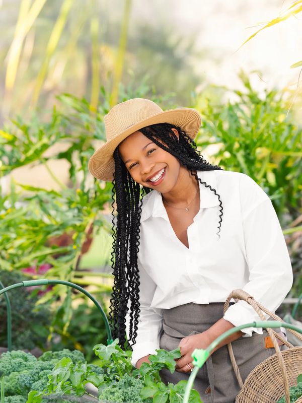 Black woman in garden with basket