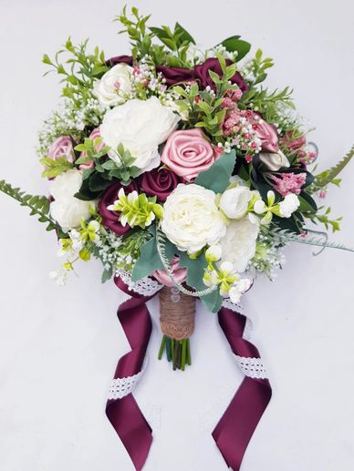 Bridal Bouquet
burgundy , pinks and ivory with peonies and gyp