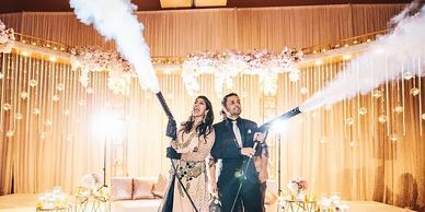 A couple using CO2 guns at an event.