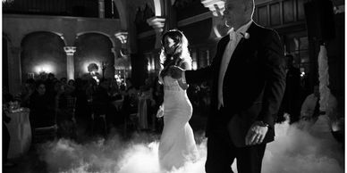 A couple dancing in clouds.