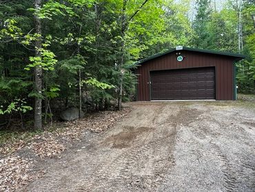 Recent removal of trees off of a garage roof.