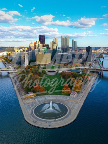 Point State Park, Pittsburgh, PA in fall foliage during sunset in October.