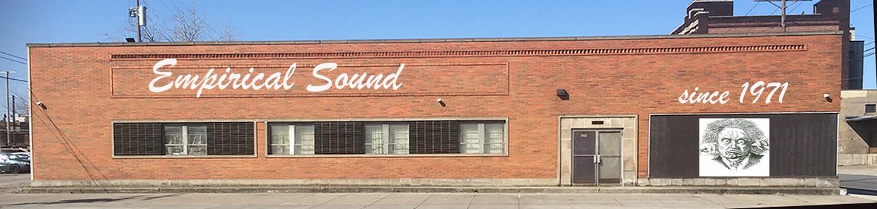 Brick building with "Empirical Sound since 1971" and a quirky Einstein drawing.