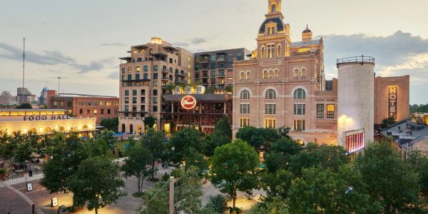 Urban cityscape with historic and modern buildings at dusk.