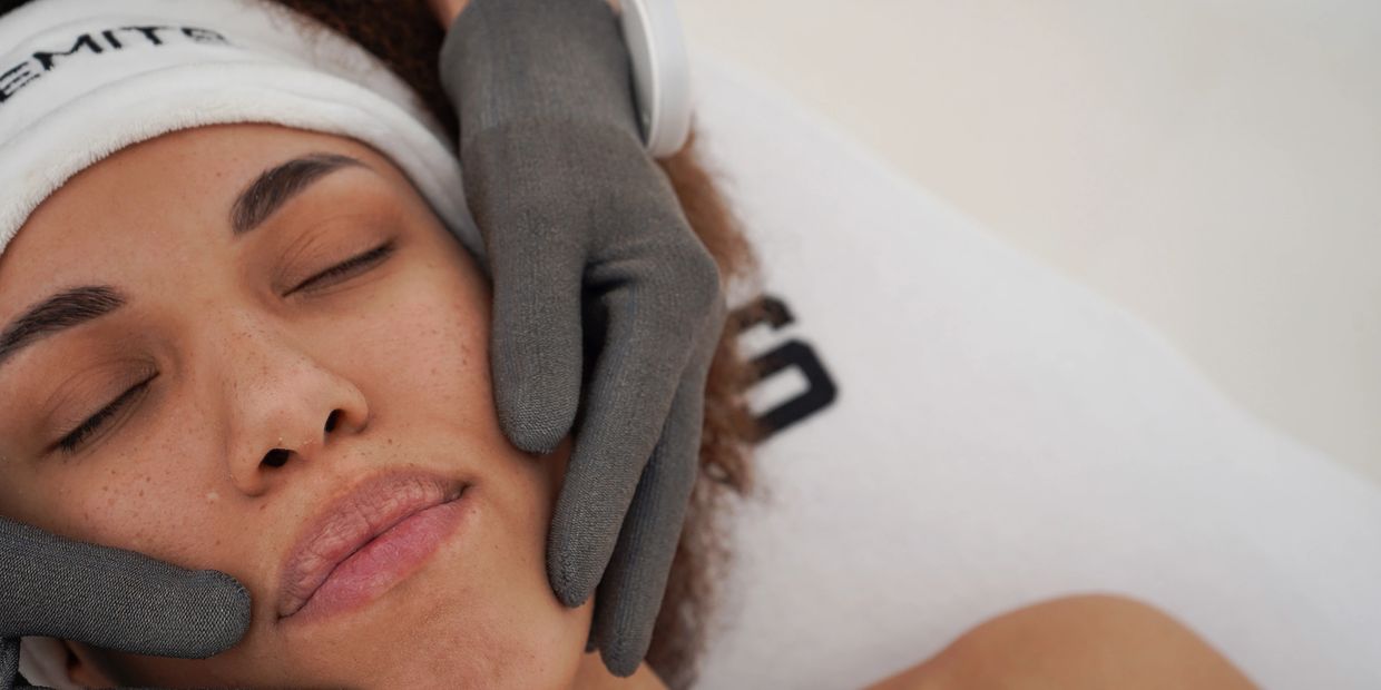 Woman receiving a facial treatment.