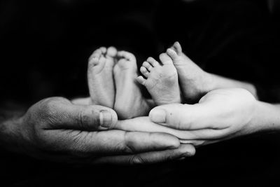 black and white photos of twin newborn feet