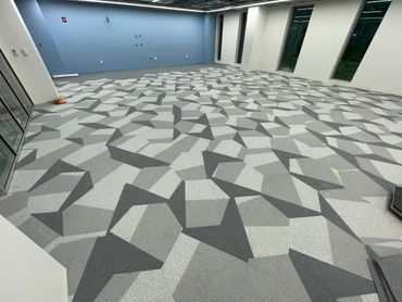 Custom hexagon carpet tile installation at a private school