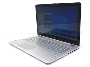 Sleek silver HP laptop with a large screen and spacious keyboard.