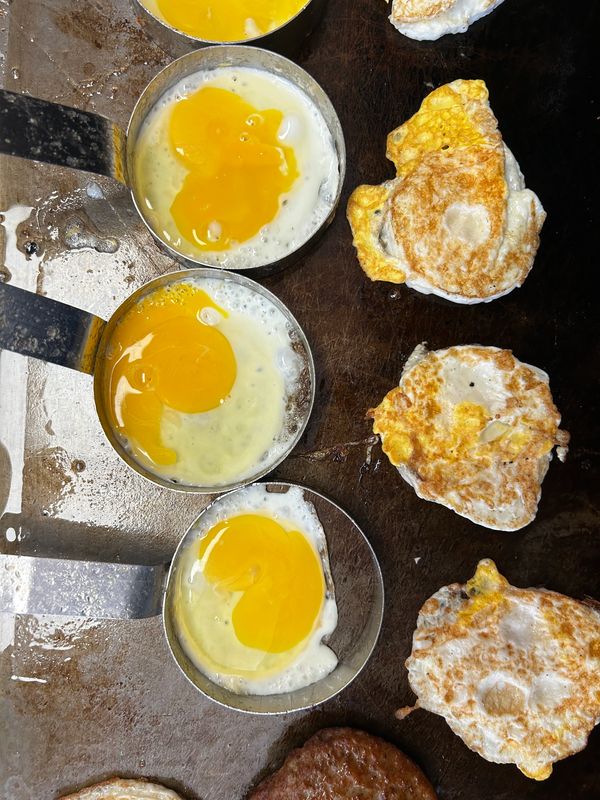 Fresh cracked fried eggs for breakfast sandwiches or bowls