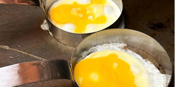 Fresh Cracked Fried Eggs Cooking