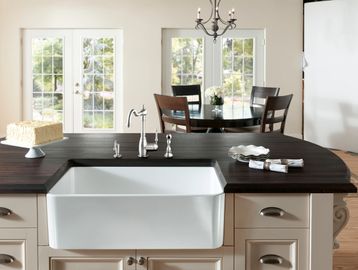 apron sink with custom wood countertops and white ceramic apron sink, classic kitchen design