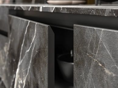 Modern kitchen doors with veined stone cabinetry, sleek black fixtures, and refined worktop styling.