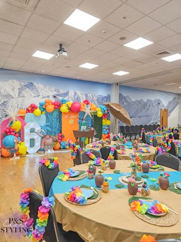 Large moana themed balloon display with moana themed table decor.
