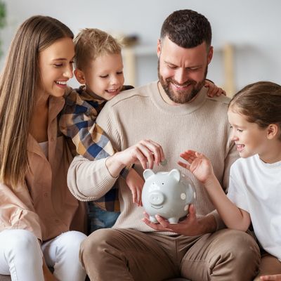 Happy family saving money together.