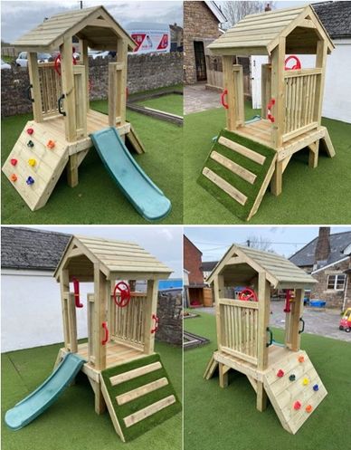 Mini Activity tower with grass covered climbing ramp climbing wall and slide
