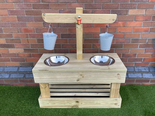 Weighing and measuring station with balance scales over, outdoor wooden educational resources.