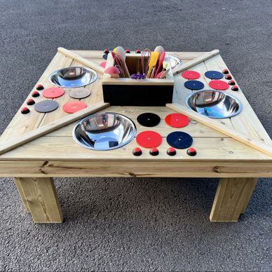 Kids mud kitchen in the style of an island unit. Children's outdoor, square mud kitchen