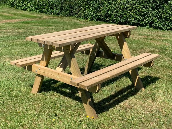 Wooden picnic table with bench style seats