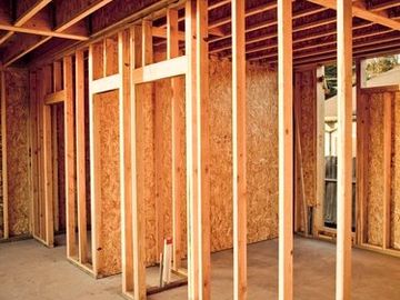 Wooden frame structure of a house under construction.