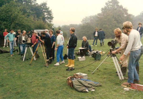 Image of crew setting up in a field to film a scene of the film of Clarke's book called Contact
