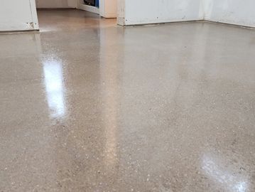 Polished Concrete stained and sealed with polish guard.
