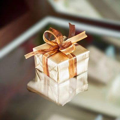 Image of a gift box placed on a glass table