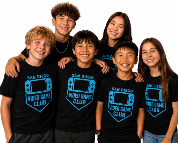 Group of kids smiling wearing San Diego Video Game Club shirts.
