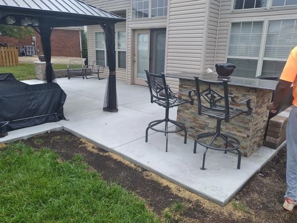 Custom outdoor kitchen and concrete patio
