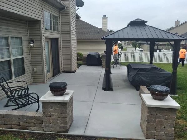 Custom concrete patio with walls and decorative concrete pieces