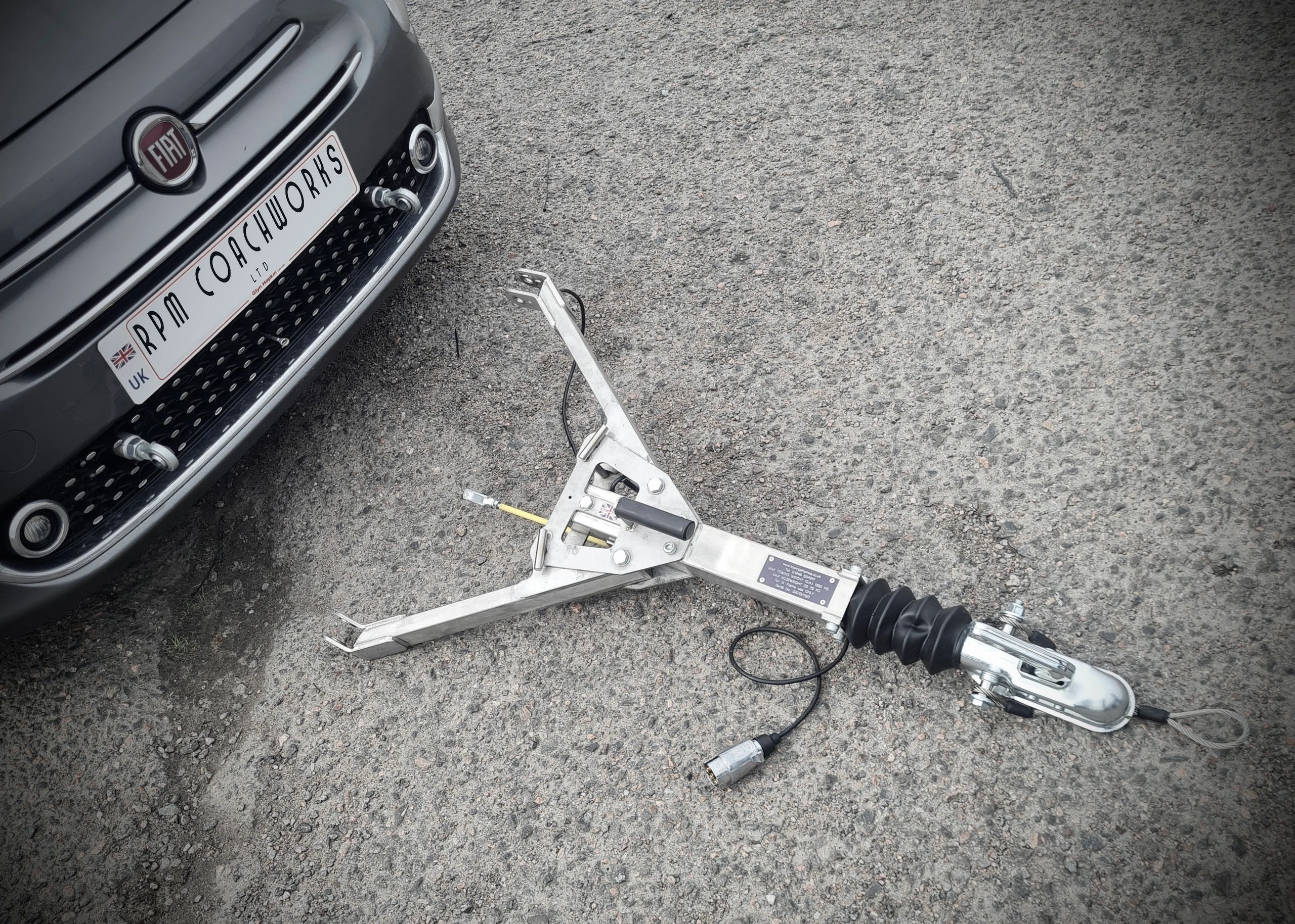 FIAT 500 with an A Frame showing the mounting points at the front oft the car