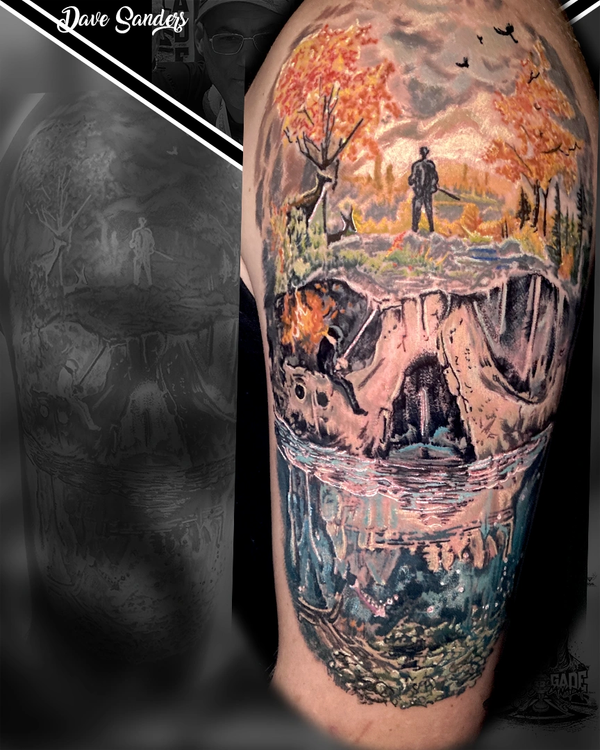Detailed skull tattoo with a complete landscape scene built into the design.