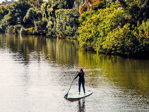 Person paddleboarding during a calm water session