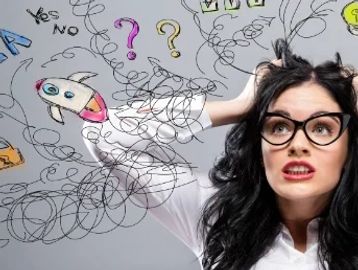 Confused woman surrounded by chaotic question marks and scribbles.