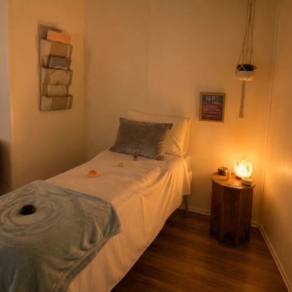 Cozy Reiki healing room with warm lighting.