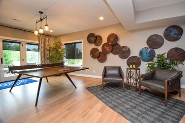 Basement game area by ID Cincinnati, featuring a fun and modern design at Homearama 2019.