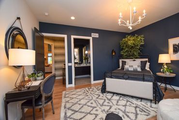 Secondary bedroom by ID Cincinnati, offering a cozy and stylish design at Homearama 2019.