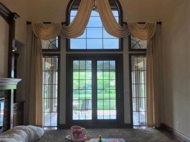 Before: Living room with large windows ready for a refreshed and inviting new look.