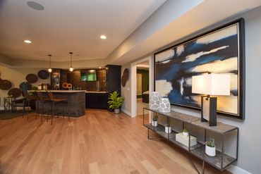 Basement bar by ID Cincinnati, featuring sleek design and functional elegance at Homearama 2019.