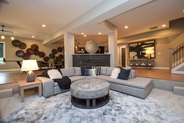 Basement sitting area by ID Cincinnati, offering a cozy and stylish retreat at Homearama 2019