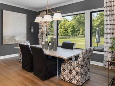 Dining area by ID Cincinnati & Robert Lucke Homes, featuring elegant, modern design at Homearama 202